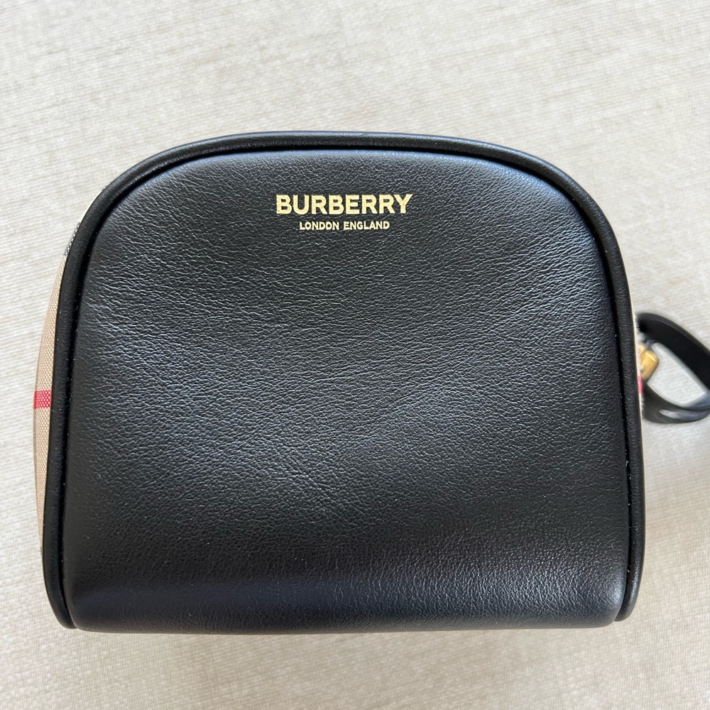 Beautiful like new Burberry mini bag. Lock and key that can be used . No marks.